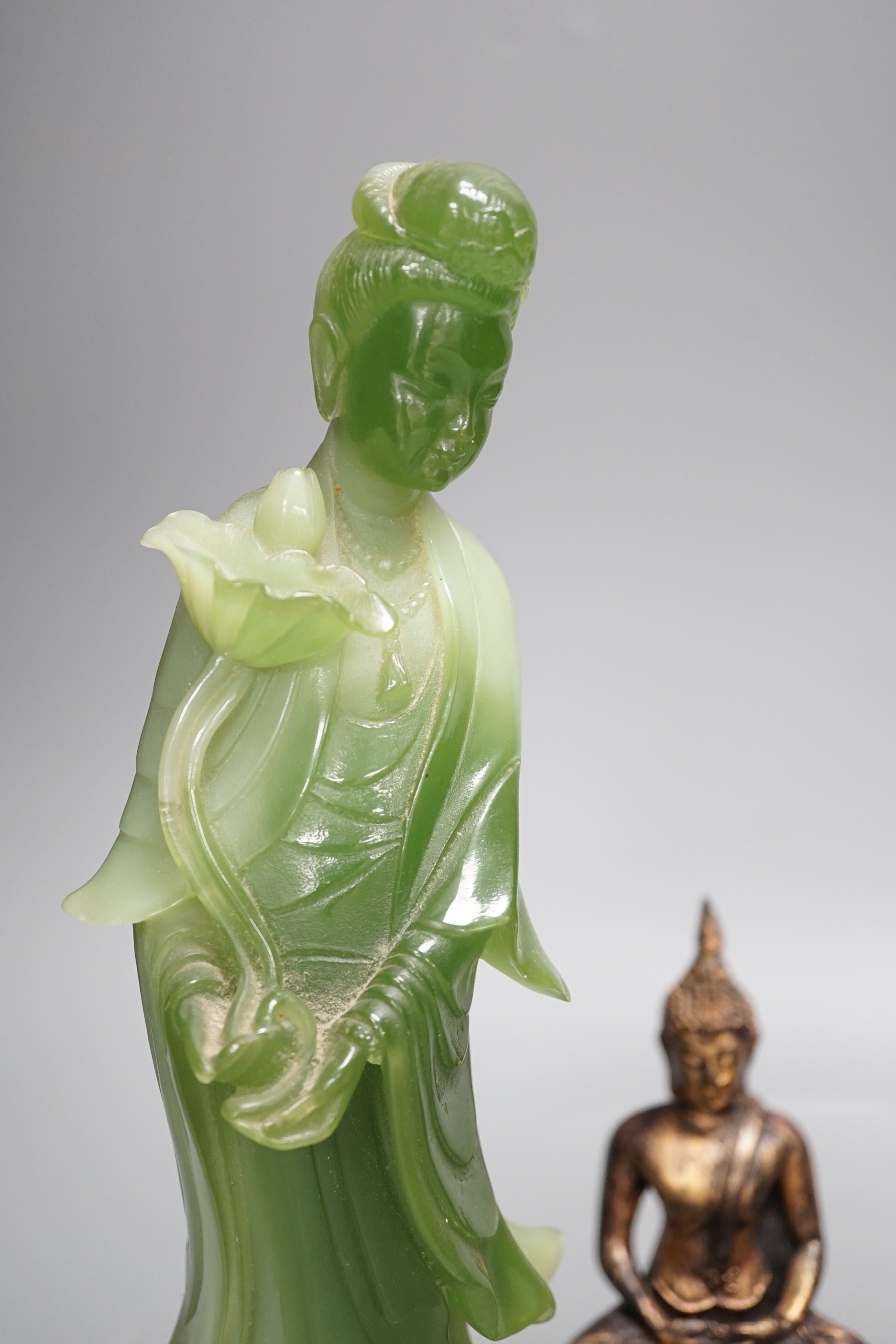 A Thai gilt resin model of Buddha, an Indian bronze model of Ganesh, a jadeite coloured carving of Guanyin and two other figures. Tallest 30cm